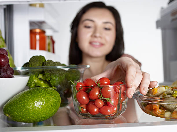 Woman Taking Cherry Tomato