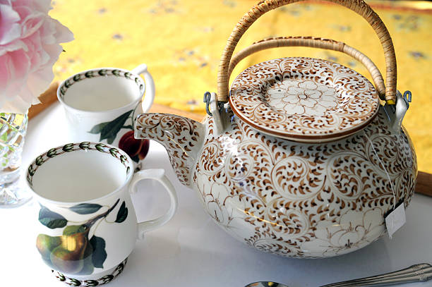 Teapot and cups stock photo