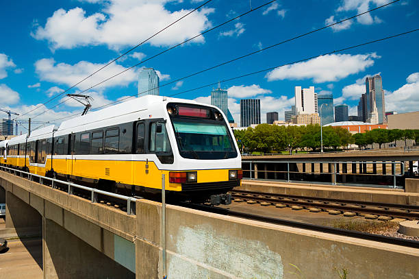 istock Dallas skyline and DART Light Rail train 185212587