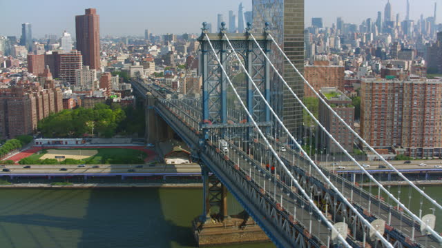 AERIAL Manhattan Bridge on a sunny day in NYC, USA