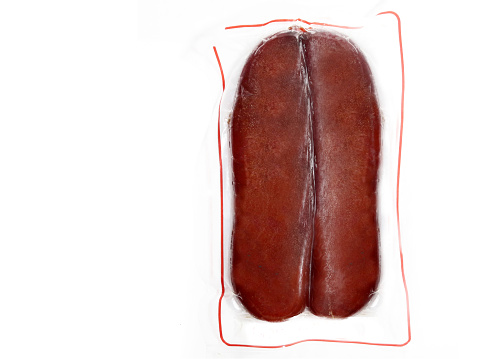 Packaged mullet roe. Taiwanese sun-dried mullet roe. Mullet roe. Taiwan famous product. It is mullet roe that has been exposed to sunlight. White background