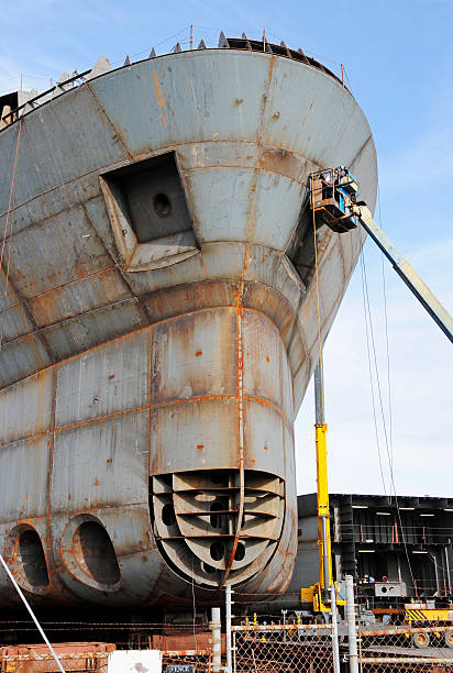 istock Man welding seams on research vessel at shipyard 185212754