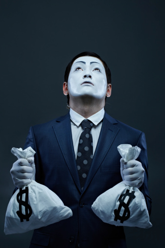 Business mime with two money sacks looking up