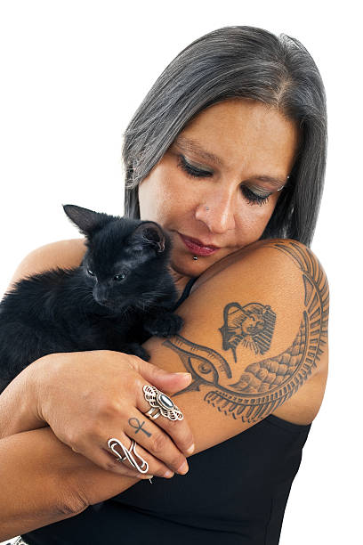 istock Woman is hugging the black cat 185213205