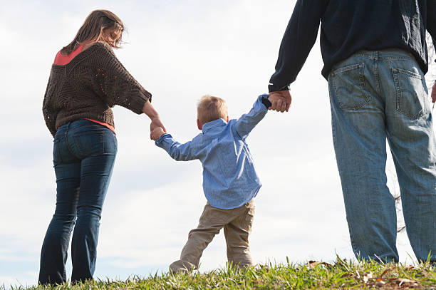 istock Parents Walking With Little Son 185213217