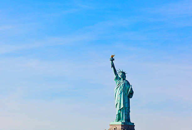 View of the Statue of Liberty against blue sky