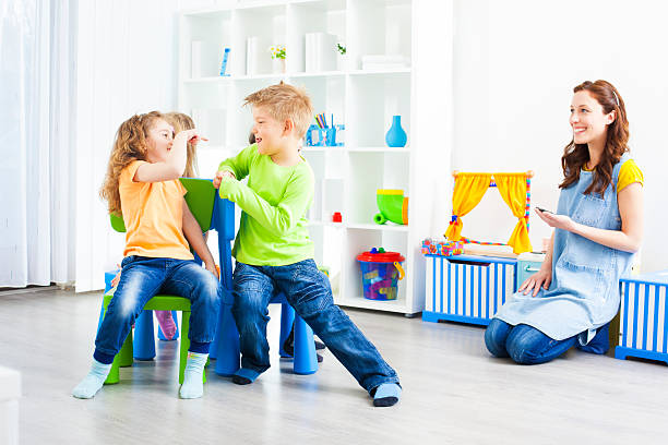 istock Preschool: Preschoolers Playing Musical Chairs. 185213333