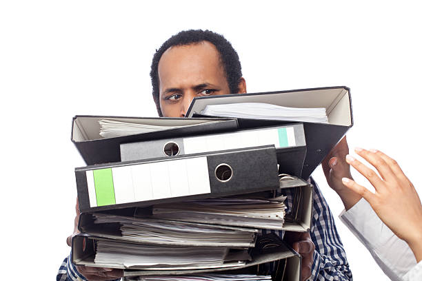 istock Young business man carrying archives 185213682