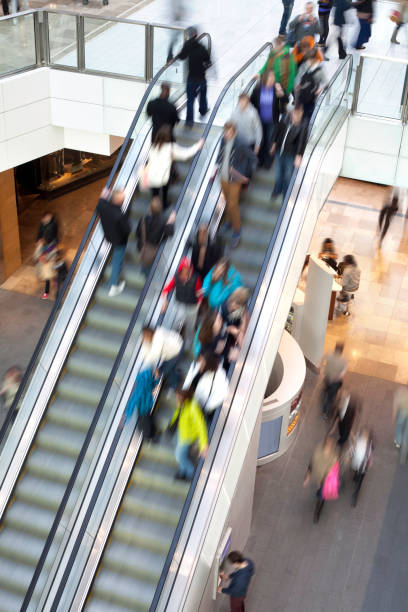 istock People on shopping centre escalator 185214002