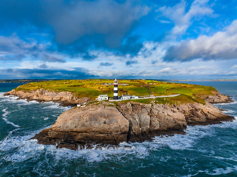 Lighthouse on th edge of the Atlantic Ocean. South Of Ireland.
