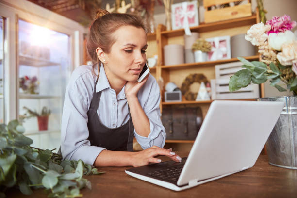 istock Self employed florist working at flower shop 1852144470