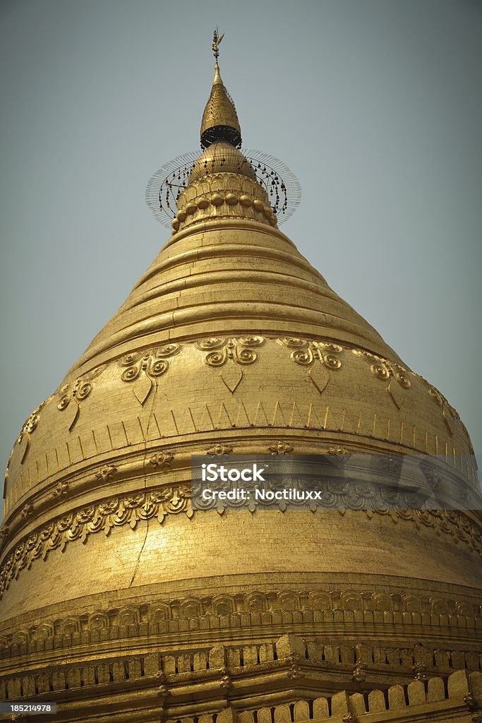 Shwezigon pagoda in Bagan "Gold plated Shwezigon pagoda in Bagan, Myanmar" Acute Angle Stock Photo