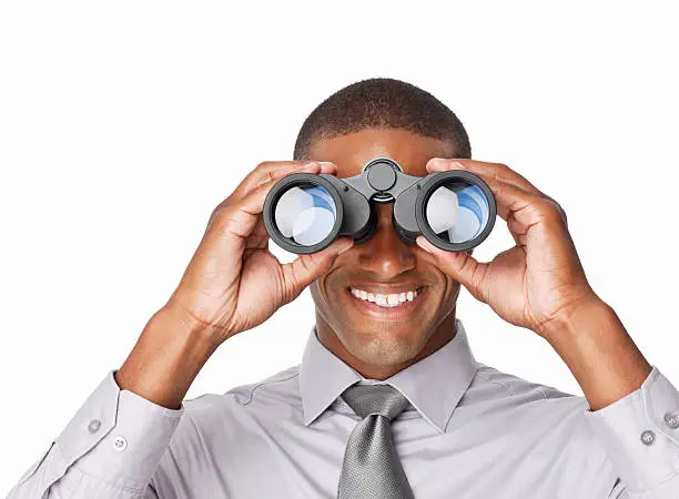 Photo of Businessman Looking Through Binoculars - Isolated