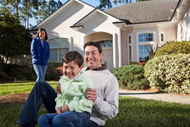 istock Family in front of house 185215608