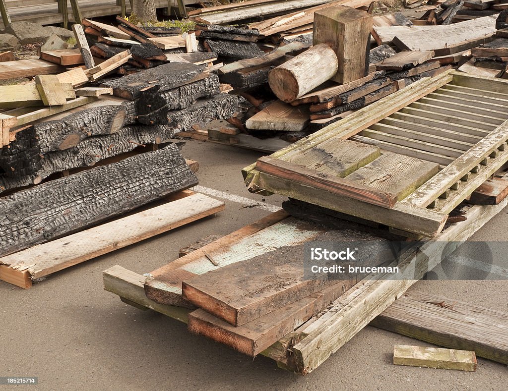 Scrap Wood Wood salvaged from fire damage sorted and ready for recycling into construction or remodeling.Construction photos here... Arrangement Stock Photo