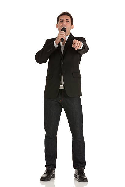 istock Businessman speaking into a microphone 185216252