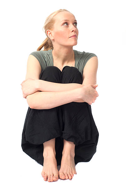 istock yoga woman waiting while sitting isolated on white 185216780