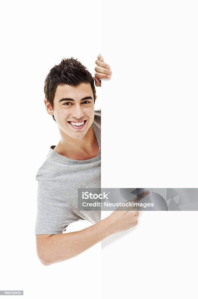 Jovem apontando em um canto-isolado - Foto de stock de Adolescente royalty-free