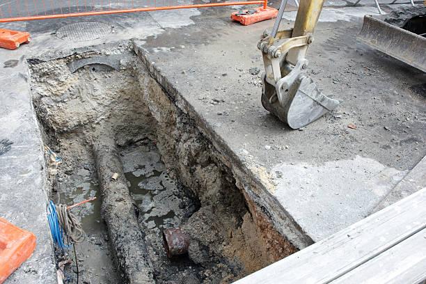 istock Road construction ditch revealing water pipe 185217259