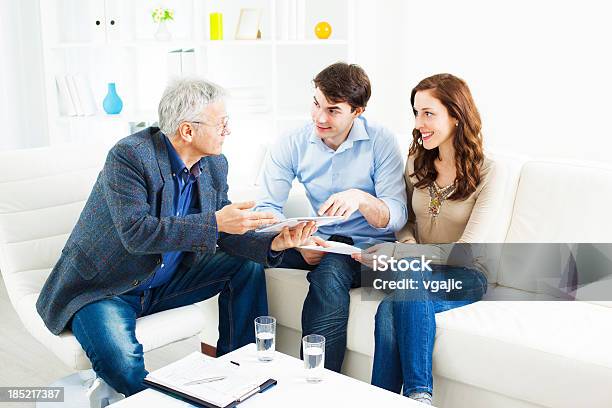 Couple Meeting With Financial Advisor Stock Photo - Download Image Now - Digital Tablet, Cheerful, Contract