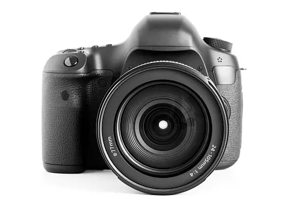 "Full-frame DSLR camera with CMOS 22.3 Megapixel sensor with attached zoom lens 24-105 mm, F4. Isolated on white."
