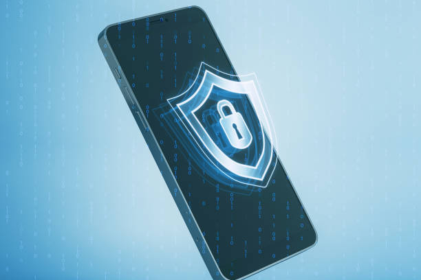 istock Close up of smartphone with creative digital security padlock and shield hologram on blurry binary code background. Secure, safety and identification concept. 3D Rendering. 1852183084
