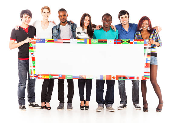 multi-ethnic group of young adults multi-ethnic group of young adults. image shows public-domain flags from the CIA world factbook. apartheid sign stock pictures, royalty-free photos & images