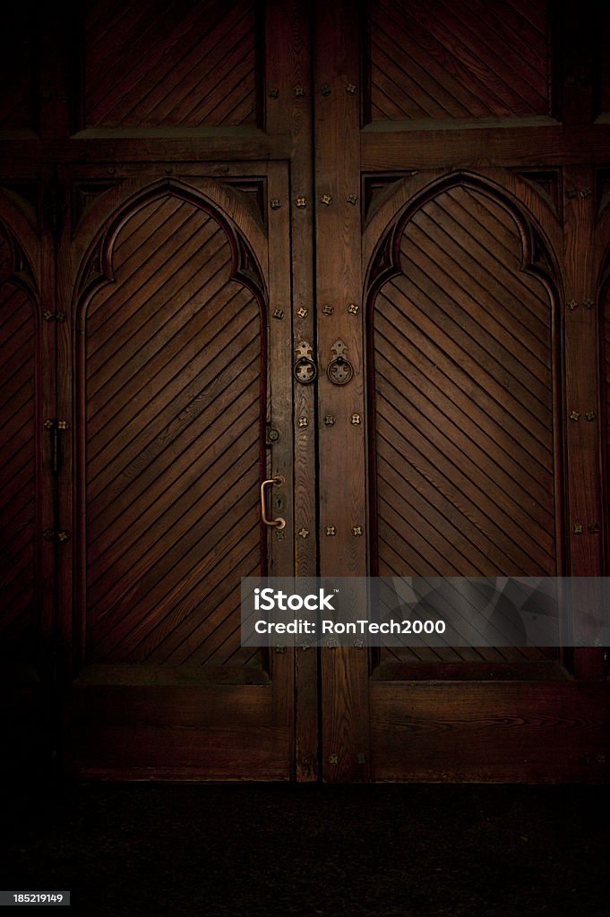 Darkened Doorway darkened double door / mysterious and heavy / what is behind it Architectural Feature Stock Photo