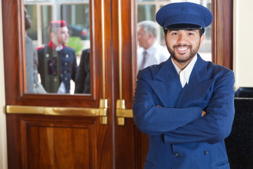 Door man portrait at a 5-Star hotel entrance.