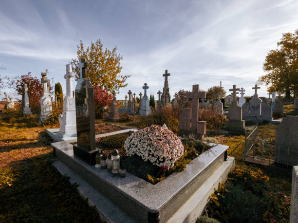 istock Graves with crosses in the cemetery on a sunny morning. 1852191820