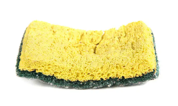 "Used yellow and green sponge, isolated on white background."