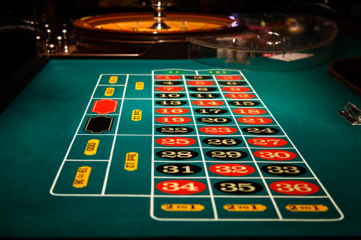A roulette table inside a casino.
