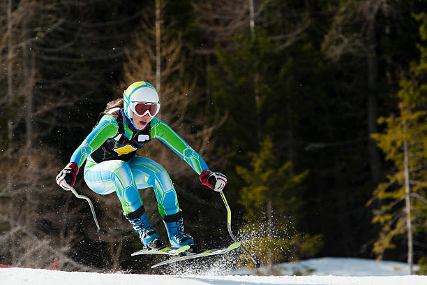 istock Female skiier jumping during the downhill race 185220125