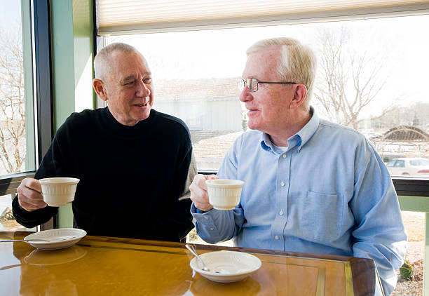 istock Senior Men Drinking Coffee in a Restaurant 185220150