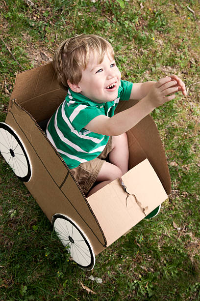 istock Little Boy in a Cardboard Car 185220418