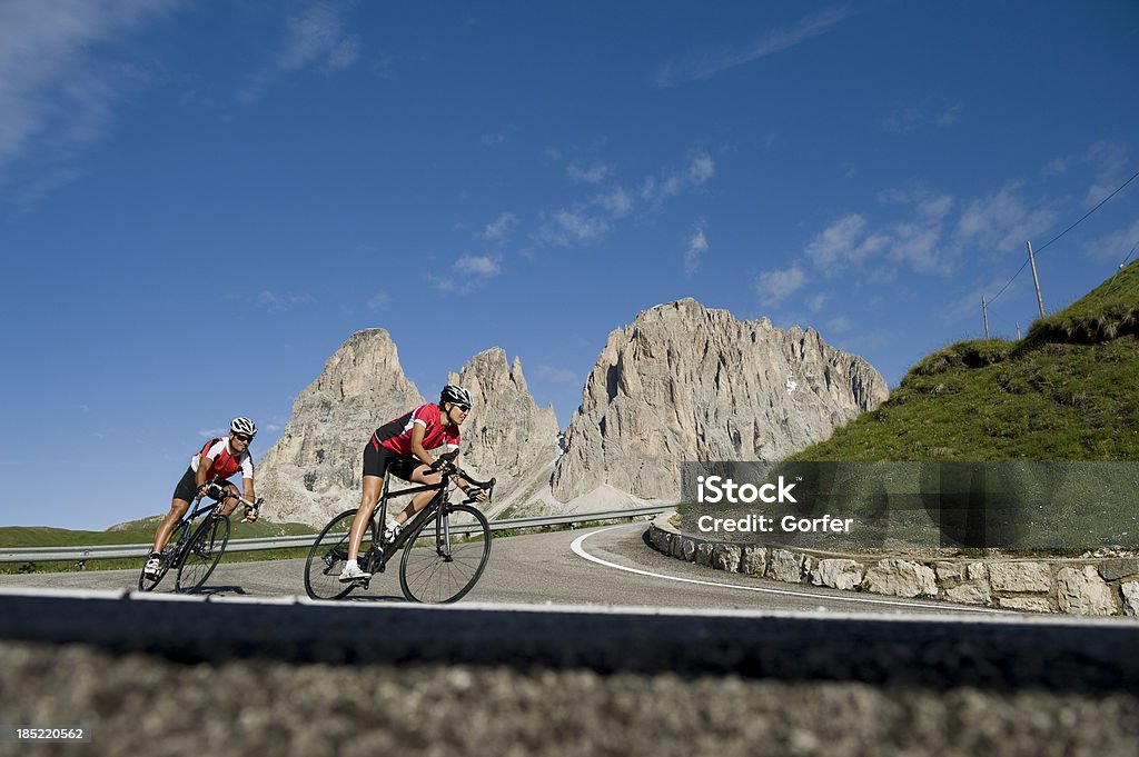 wheel driver enjoys the departure in Dolomites south Tyrol Cyclists pair or team during the descent in the Dolomites in South Tyrol Cycling Stock Photo