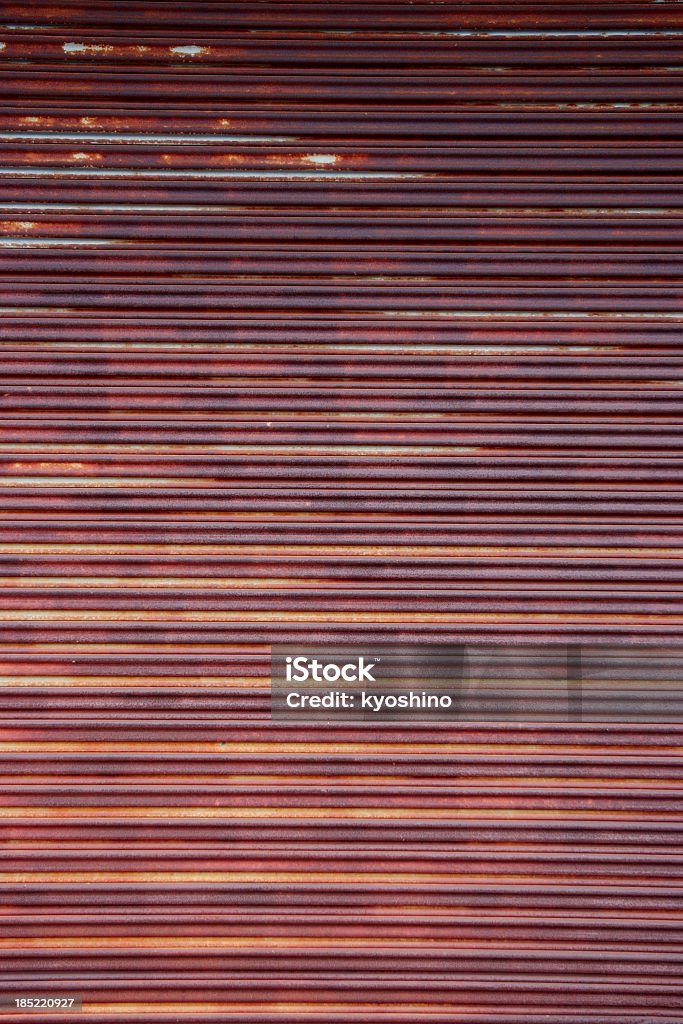 Close-up of rusty rolling garage door background Close-up of rusty rolling garage door background. Absence Stock Photo