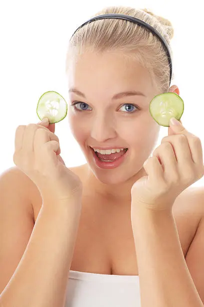 young beauty holding cucumberslices for her eyes**MORE PICS ARE HERE: