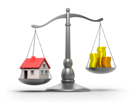 Scales with house and money - isolated / clipping path