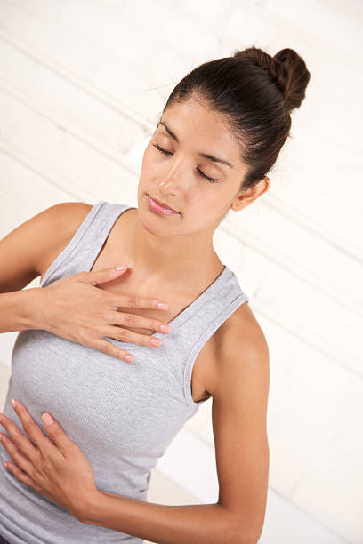 istock Front view of attractive female while meditating 185221708