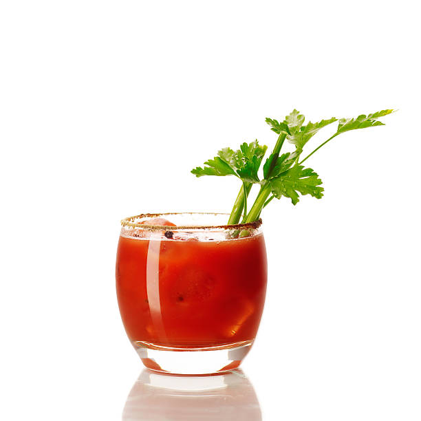 bloody Mary cocktail "cocktail Bloody Mary served in glass with parsley, isolated on white background." bloody mary stock pictures, royalty-free photos & images