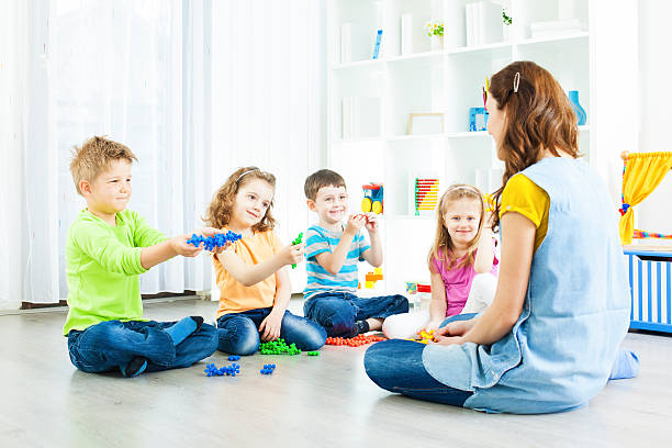 istock Preschool: Children Having Activities with Blocks Puzzle. 185221932