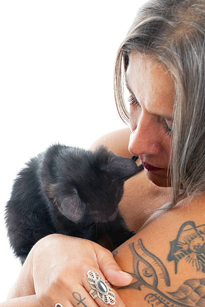 istock woman hugging the black cat 185222793