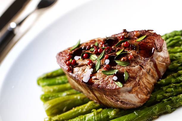 istock Beef fillet with pink pepper and asparagus 185223254