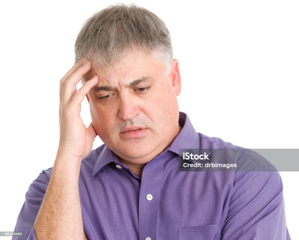 Distressed Man Portrait of a mature man on a white background. Despair Stock Photo