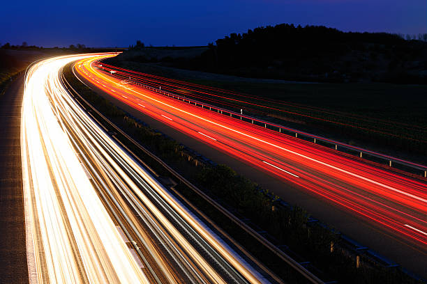 istock Blurred Motion of Car Lights on Highway at Night 185223490