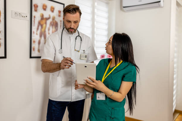 istock Doctors Utilize Digital Tablet for Real-Time Patient Information and Treatment Planning 1852235916