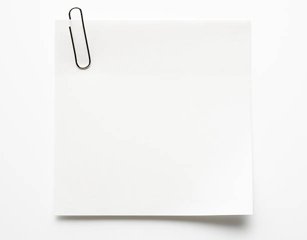 Blank white sticky note with paper clip on white background Blank white sticky note and paper clip isolated on white background with clipping path. note pad photos stock pictures, royalty-free photos & images