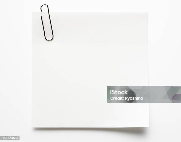 Blank White Sticky Note With Paper Clip On White Background Stock Photo - Download Image Now