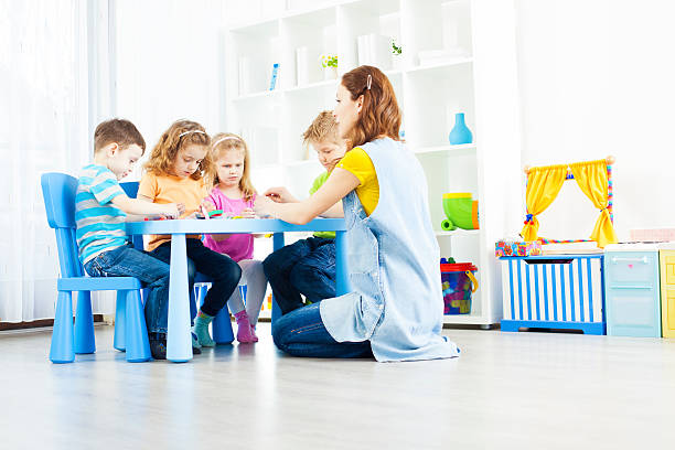 istock Preschool: Children Having Craft Activities with playdo. 185223842